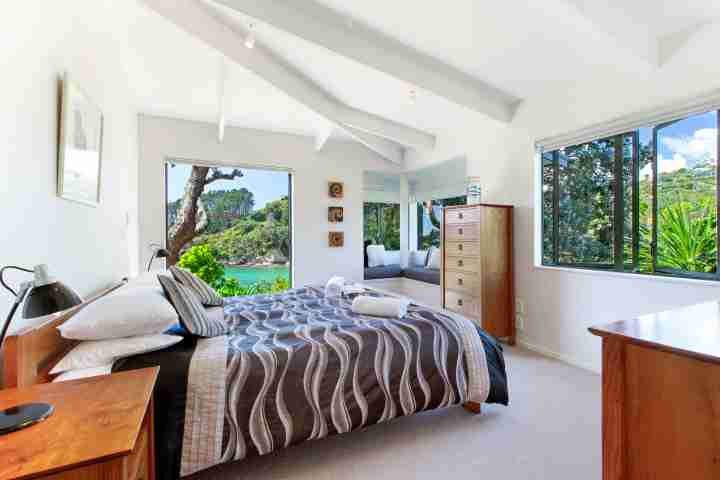 Spacious, sunny double bedroom with outdoor access and sea view