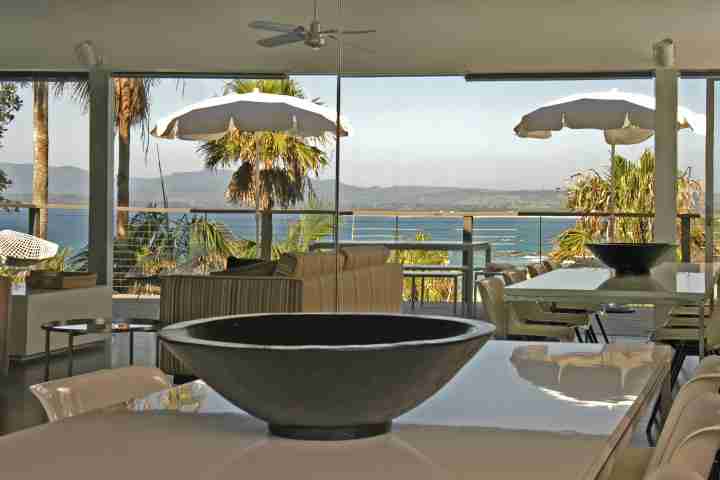 Entertain in large living and dining area with outdoor deck and ocean views