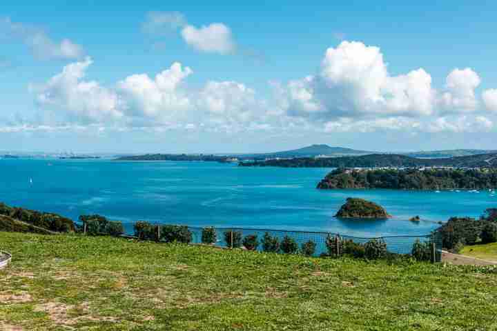 Unlimited sea views from large lawn and garden at Te Whau 