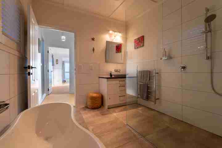 Omiha Oasis Luxury master bathroom with bath and shower