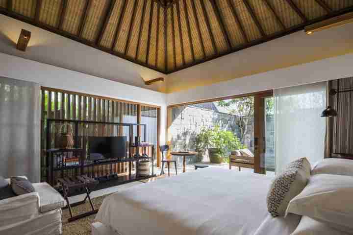 Relax in minimalist luxury in traditional Balinese style villa