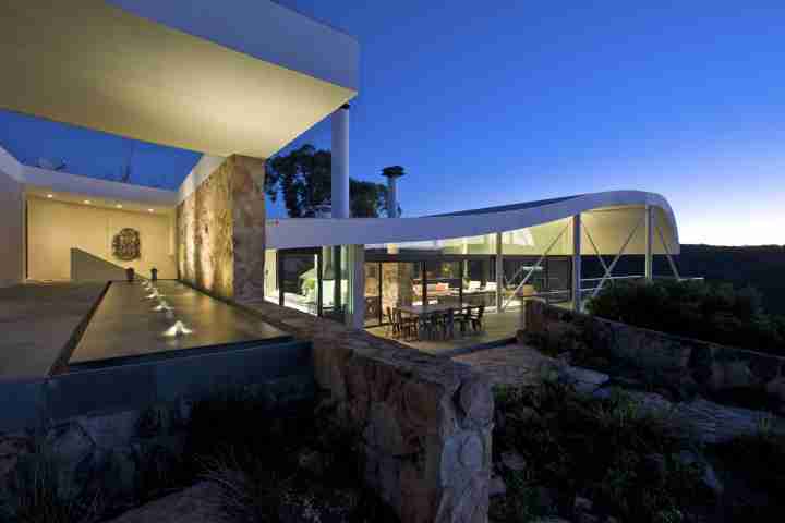 Entertain with open-plan living at night, at the iconic Seidler House, private contemporary luxury holiday accommodation in Australia Southern Highlands
