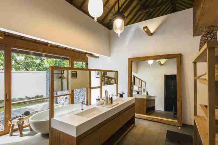 Twin sinks in modern luxury Balinese style bathroom