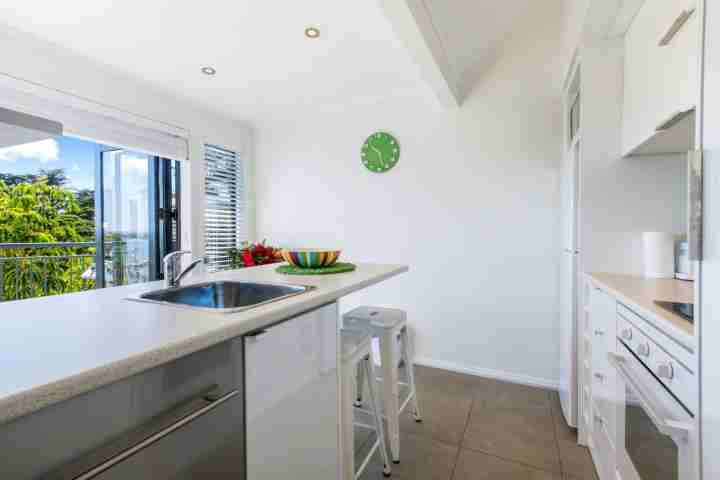 Fully-equipped kitchen at self-catered modern apartment, Palm Beach