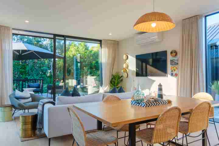 Waiata Beach House Dining area and lounge with smart TV v2