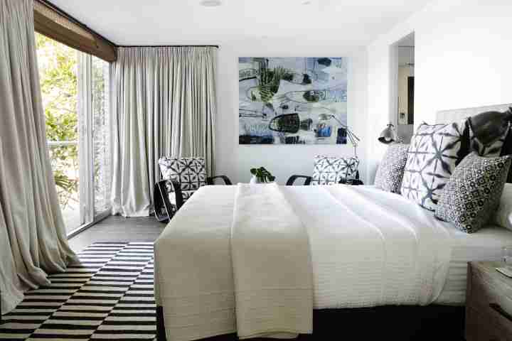 Spacious double bedroom with outdoor access at luxury accommodation, Whale Beach House Australia