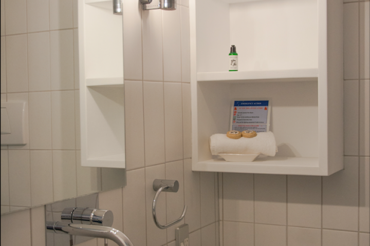 Vanity and bathroom shelving at Condo on the beach