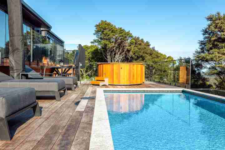 Kaitiaki Lodge sunloungers by the pool