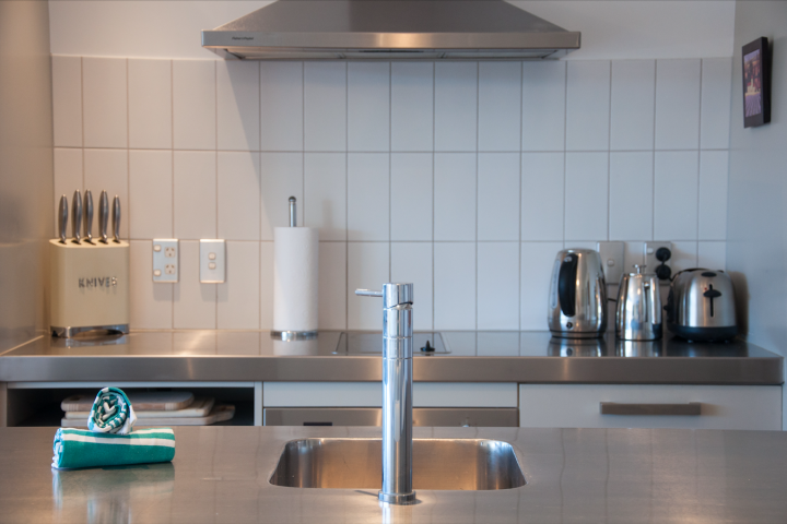 Fully-equipped kitchen featuring modern appliances and stove